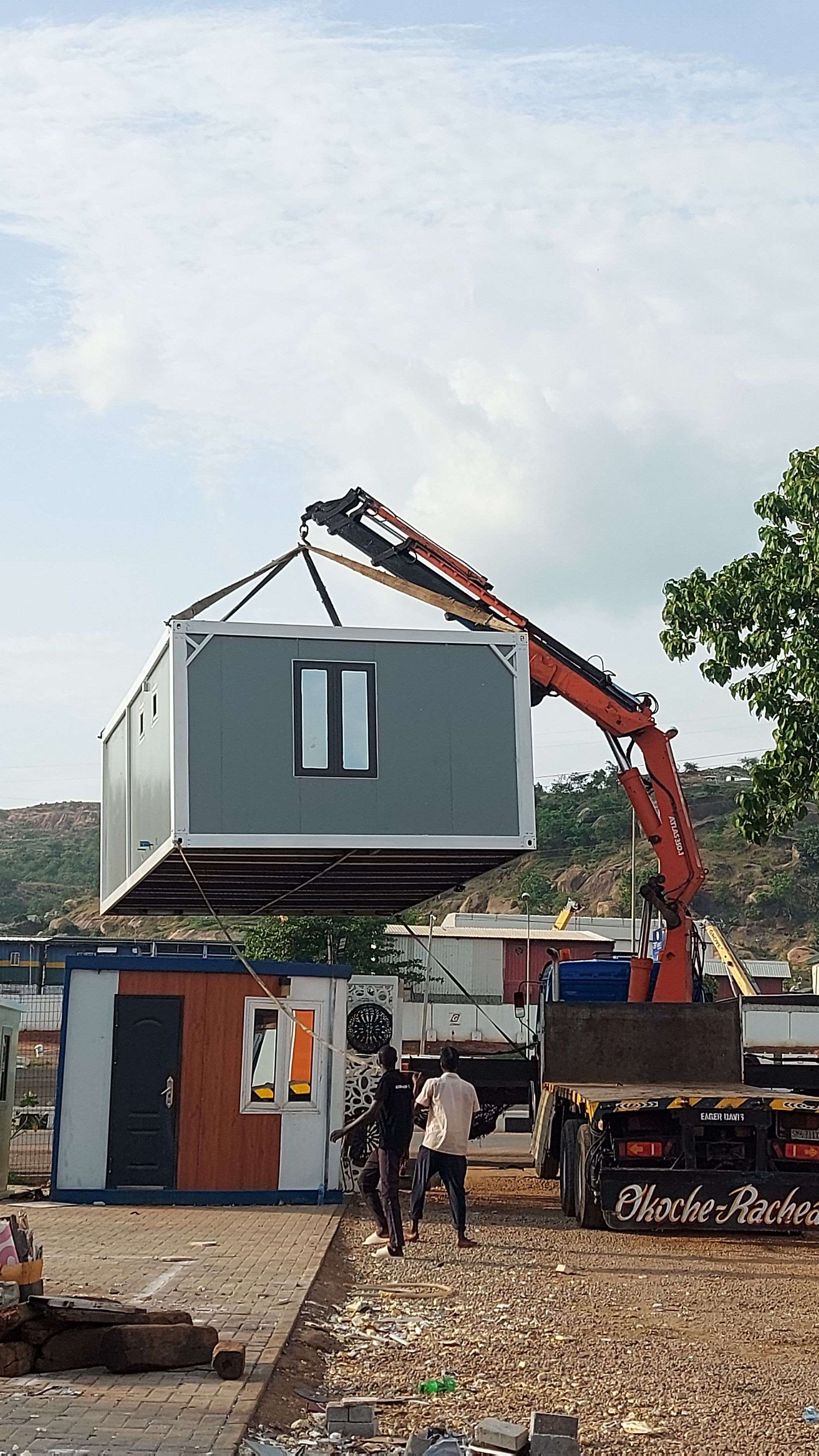 Double decker modular unit being stacked by crane