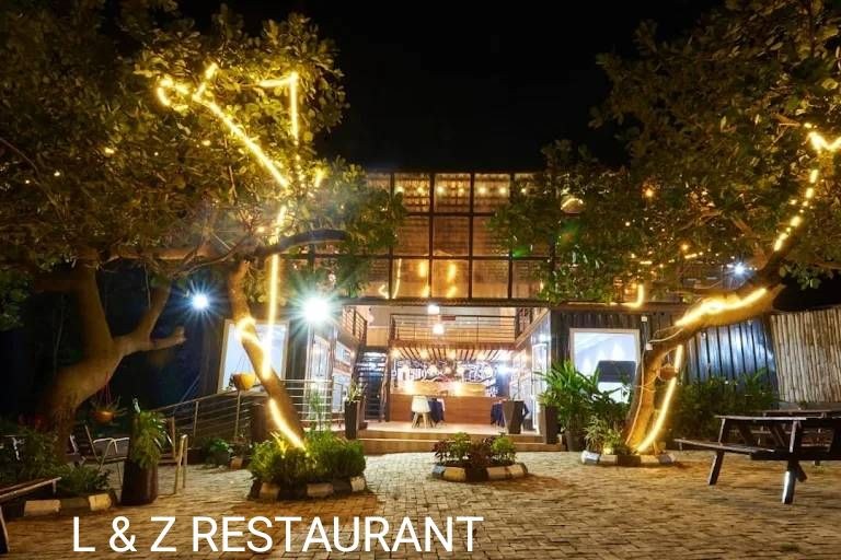 L & Z Restaurant — Courtyard at night with festoon lighting