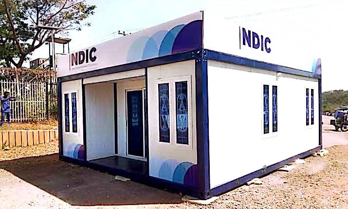 NDIC Branded Mobile Unit — Branded mobile cabin on site