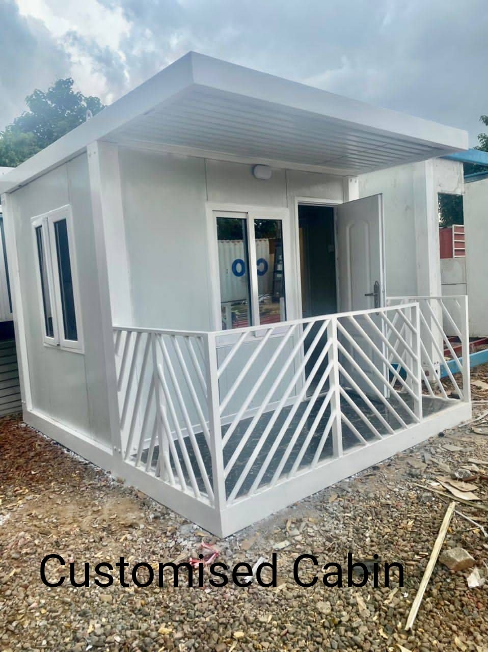 Customised white prefab cabin with verandah