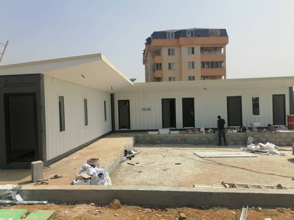 Field Deliveries & Site Installations — All-white modular extension on-site
