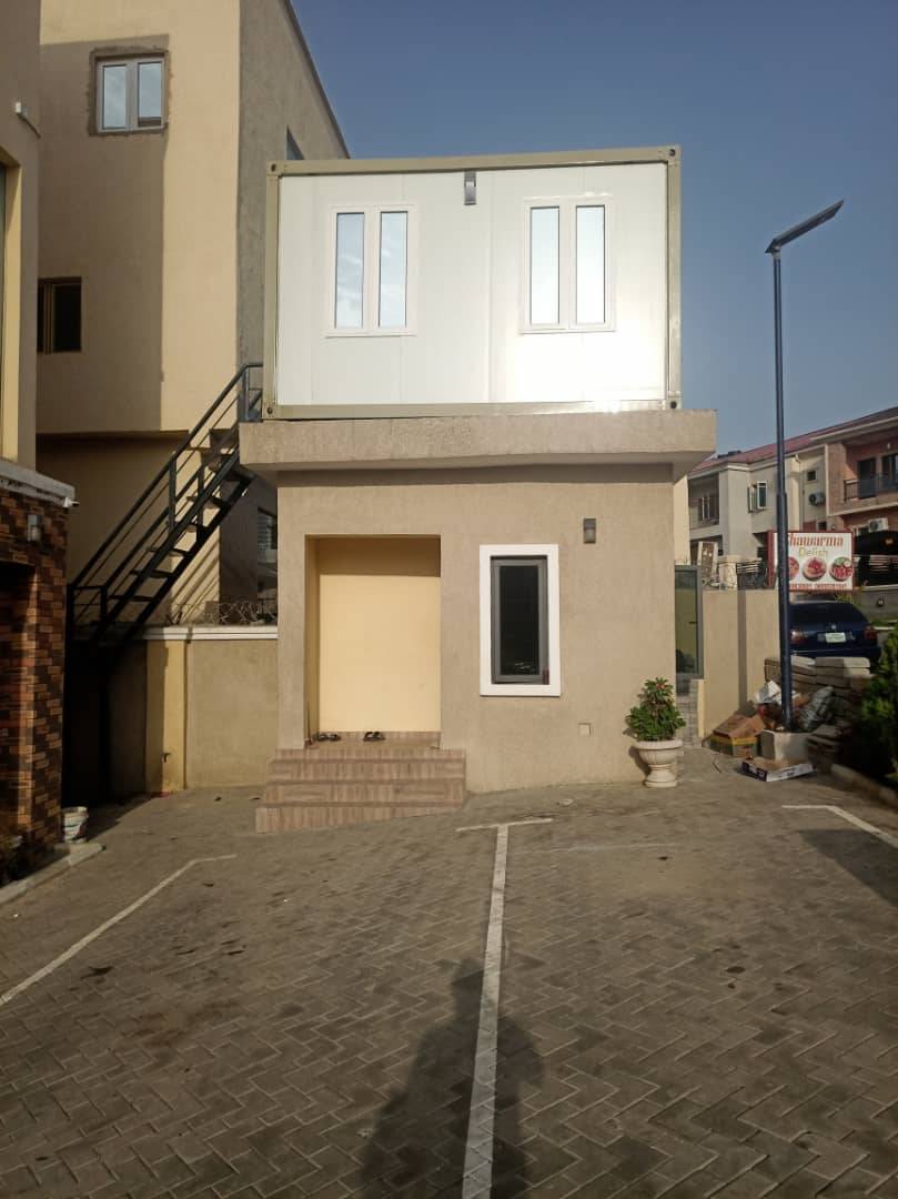 Two storey concrete and container building