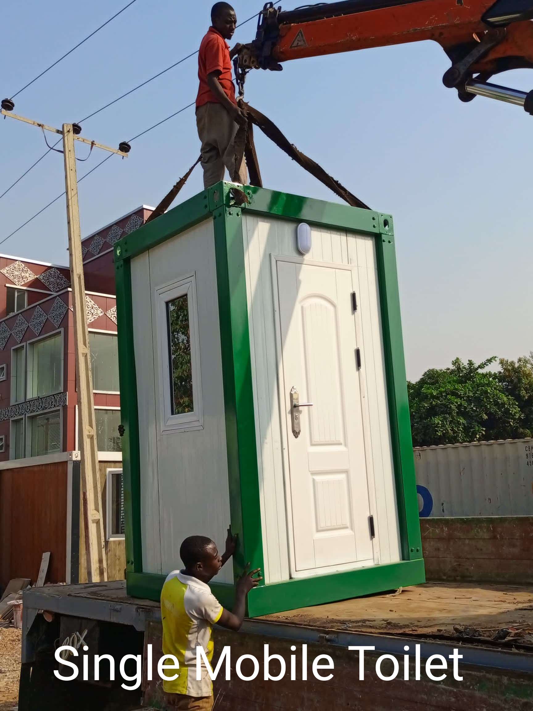 Single mobile toilet unit being lifted