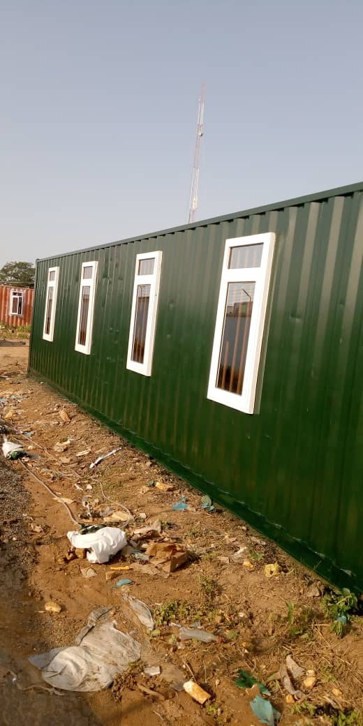 Field Deliveries & Site Installations — Green corrugated container with window line