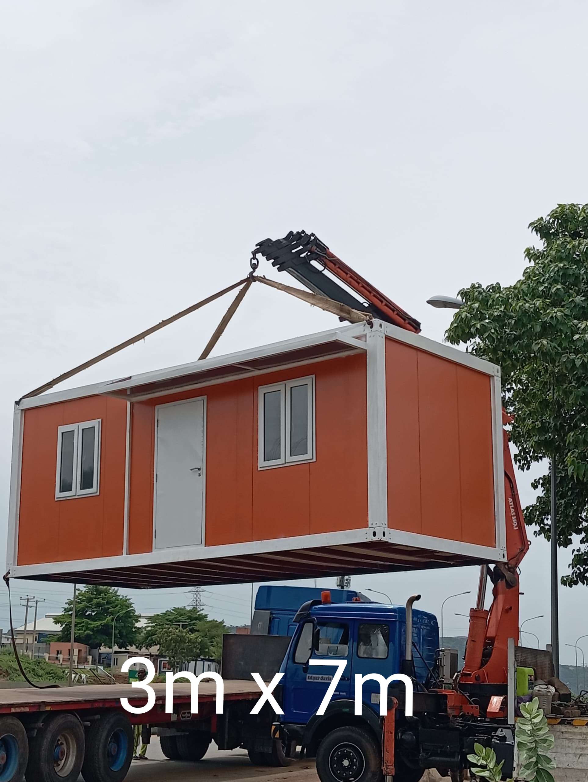 Orange 3m by 7m container office in transit