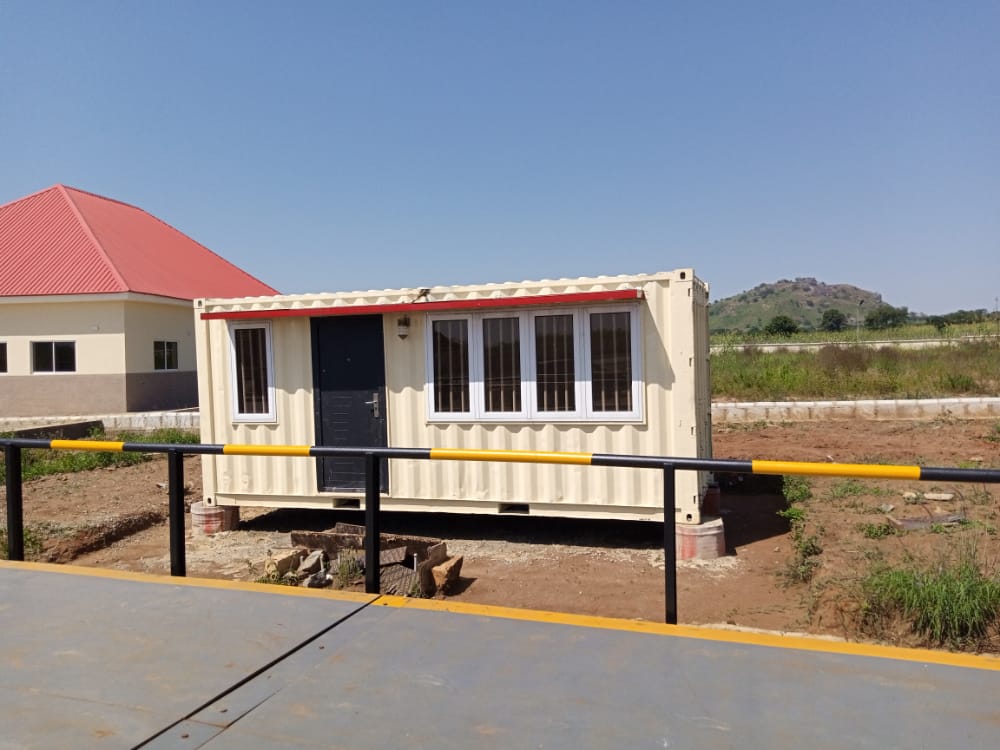 Cream Gatehouse Cabin — Gatehouse cabin at site entrance