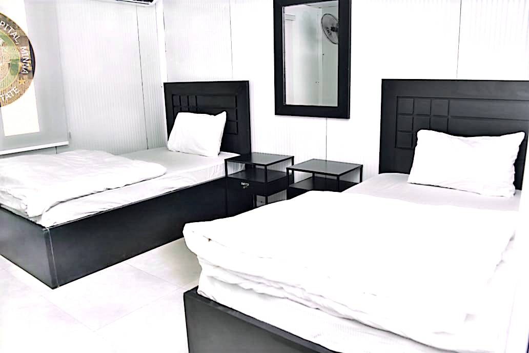 Capital Suites Lodge — Twin-bed guest suite